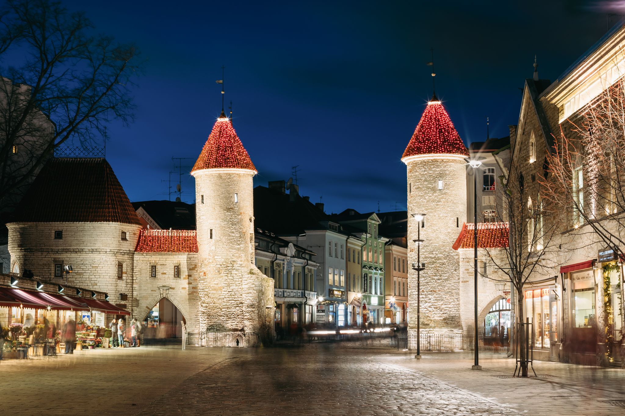 Photo of famous Landmark Viru Gate In Street Lighting At Evening, Estonia.