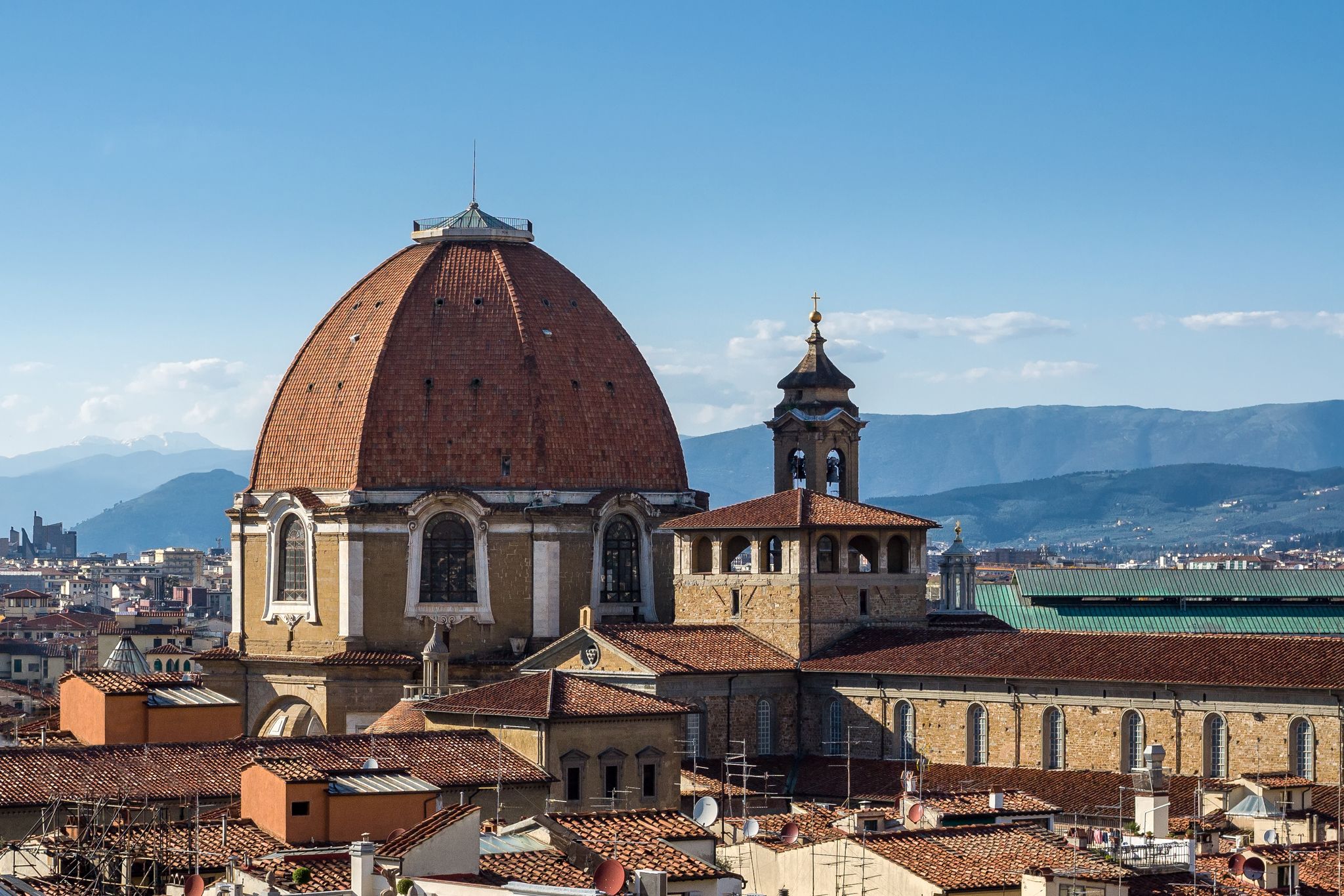 photo of The dome of the Cappella dei Principi dominates the San Lorenzo architectural complex (Medici Chapels). Aerial view from Giotto's Campanile. Florence, Tuscany, Italy.