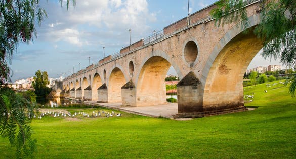 photo of a beautiful morning on The Puente de Palmas (Bridge of Palms), an impressive 582m bridge, was built in 1596. The Bridge of Palms is also known as Puento Bobo, it is the oldest bridge in Badajoz, Spain.