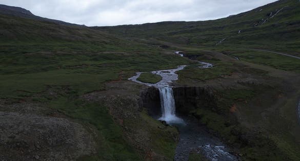 photo of AERIAL VIEW The Gufufoss waterfall is the largest in Seydisfjordur fjord, Seyðisfjörður, Iceland.
