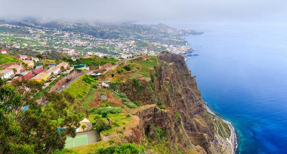 Cabo Girao, Madeira. View from the second highest sea cliff in the world towards Funchal on a foggy day