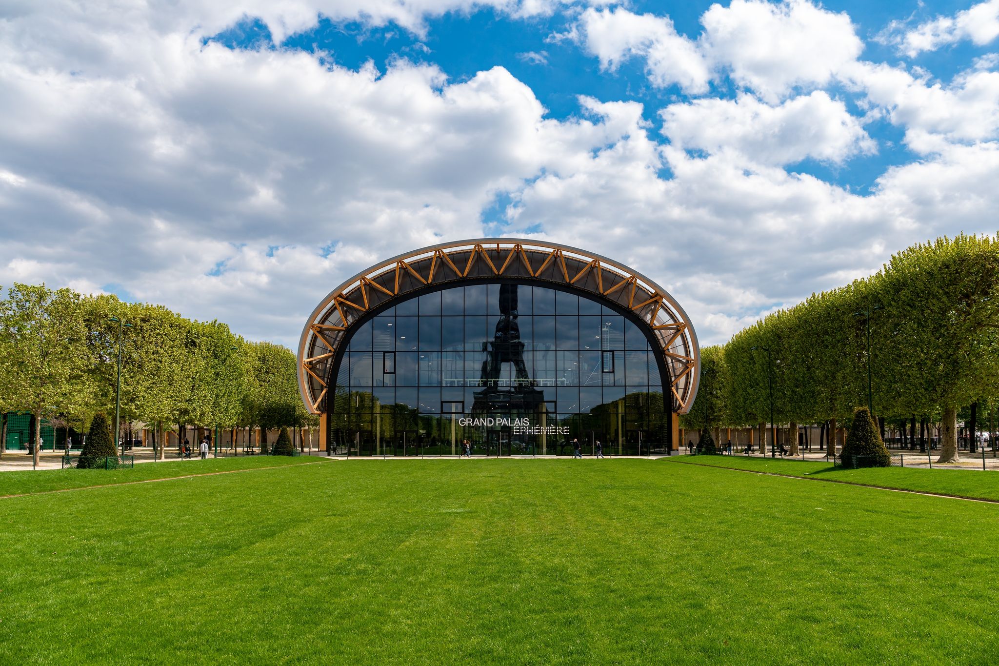 Photo of reflection of the Eiffel tower in the Ephemeral Grand Palais on the Champs de Mars, France.