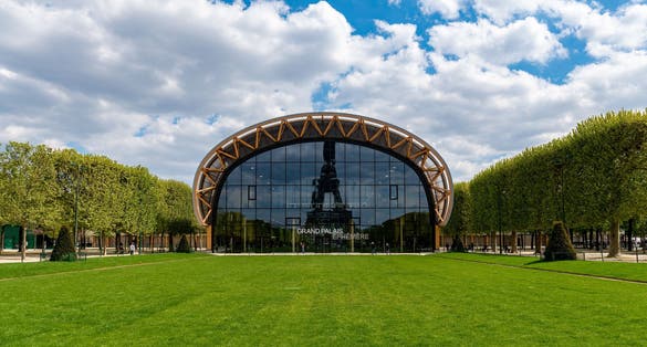 Photo of reflection of the Eiffel tower in the Ephemeral Grand Palais on the Champs de Mars, France.