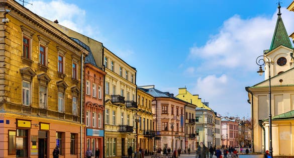 Photo of traditional colored tenements houses on central streets of Polish city of Lublin in sunny spring day, Poland.