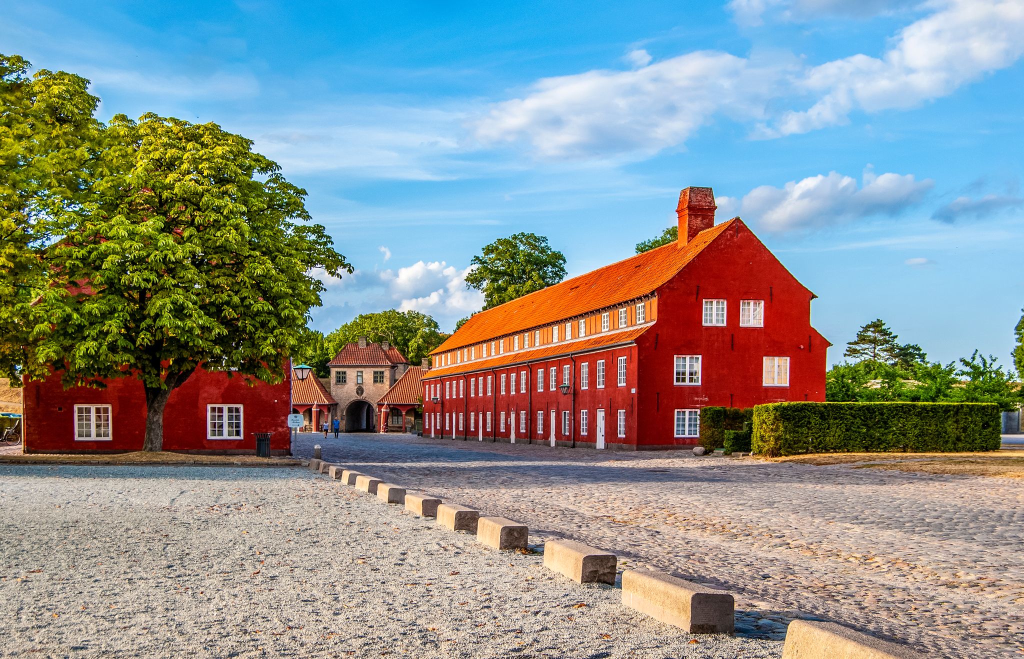 Scenic summer view of Nyhavn pier with color buildings, ships, yachts and other boats in the Old Town of Copenhagen, Denmark
