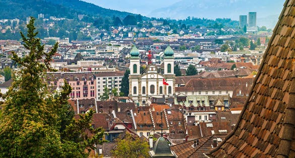 photo of aerial cityscape of Lucerne from city wall with Jesuit Church St Francis Xavier, Lucerne, Switzerland.