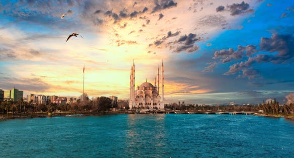 Photo of Sabanci Central Mosque, Old Clock Tower and Stone Bridge in Adana, Turkey.