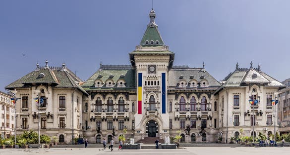 Photo of the facade of the Administrative Palace of Craiova (today Dolj Prefecture and County Council), an imposing historical monument located on the territory of Craiova, Romania.