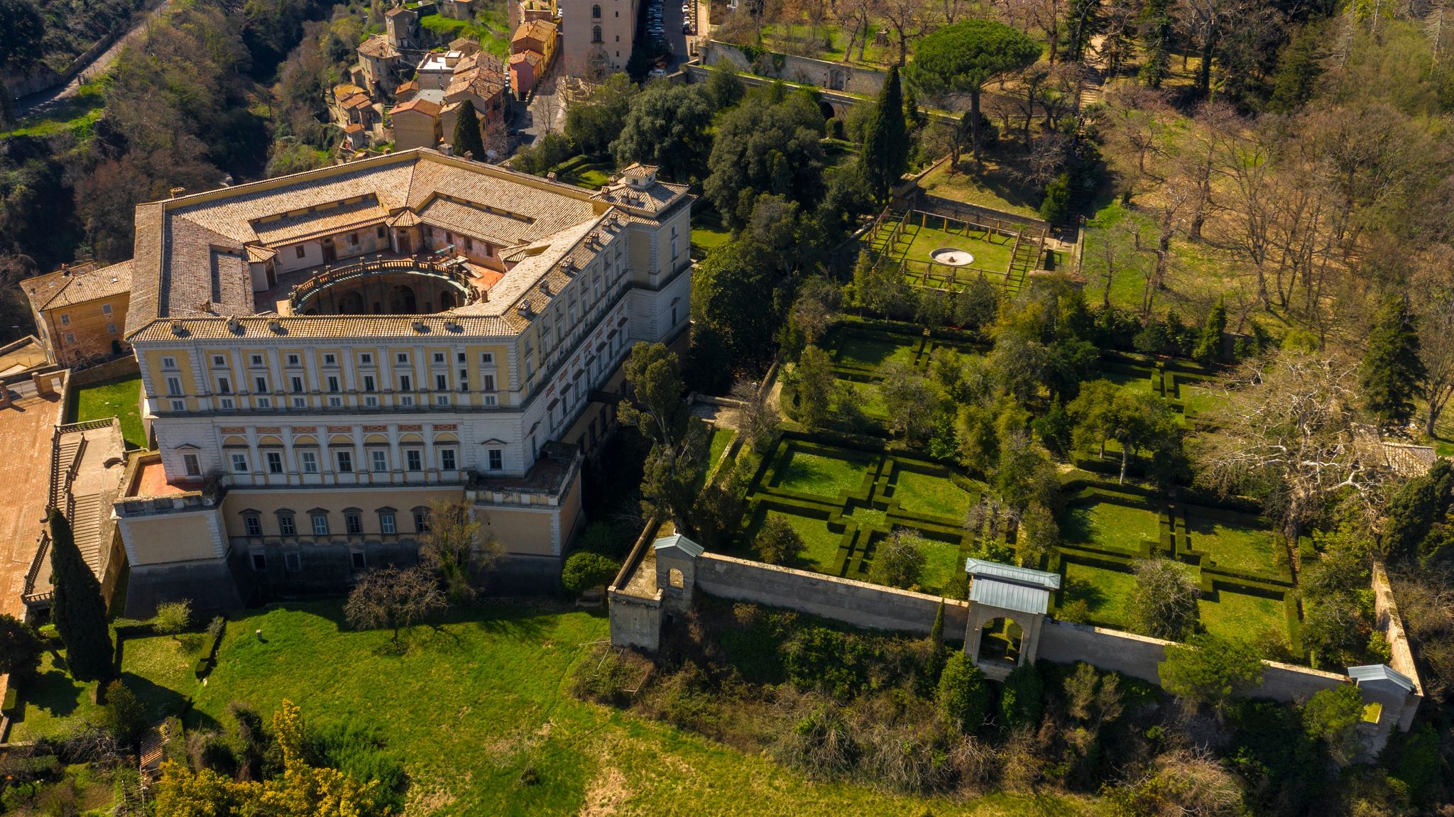 Aerial view of Villa Farnese and its gardens located in Caprarola, near Viterbo, Italy. It is a pentagonal palace in the Renaissance and Mannerist style. The building is empty.