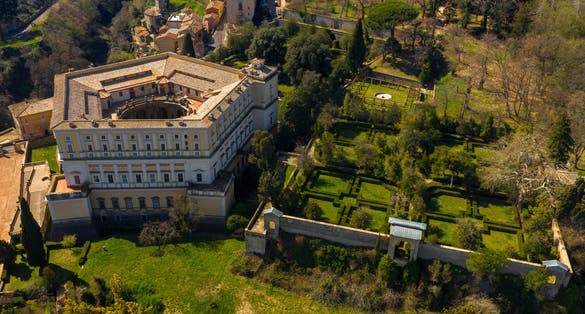 Aerial view of Villa Farnese and its gardens located in Caprarola, near Viterbo, Italy. It is a pentagonal palace in the Renaissance and Mannerist style. The building is empty.