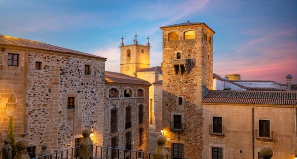 photo of view of View of the Plaza de San Jorge, with the Tower of the Los Golfines de Abajo palace as the protagonist, in Cáceres, Spain.