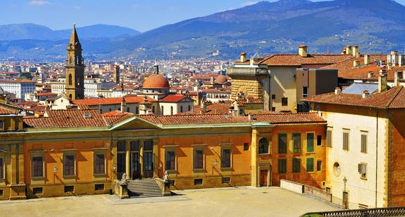 photo of skyline of the city and back view of Palazzo Pitti, facing Boboli Gardens, in Florence, Italy .