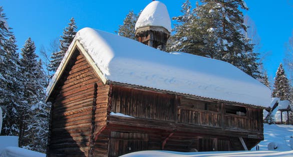 Old snowy viking log houses in Norway, Gjøvik