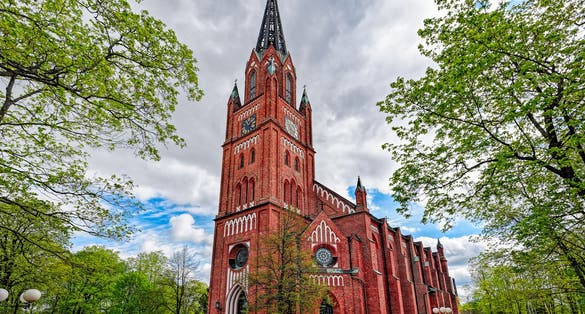 Photo of the neo-gothic Central Pori church built of redbrick was completed in 1863 in accordance with the drawings made by architect Carl-Johan von Hcideken and was restored In 1995 -1996, Pori, Finland.