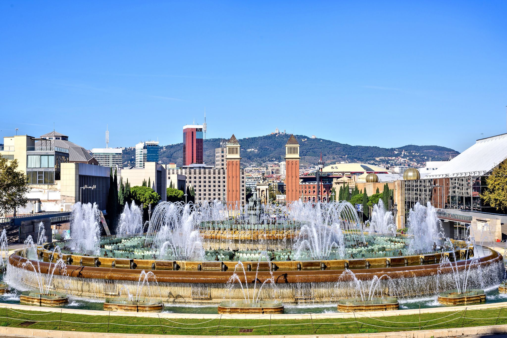 Photo of Magic Fountain Font Magica of Montjuic and Venetian Towers at Plaza Espanya, Barcelona ,Spain.