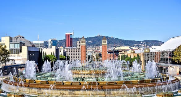 Photo of Magic Fountain Font Magica of Montjuic and Venetian Towers at Plaza Espanya, Barcelona ,Spain.
