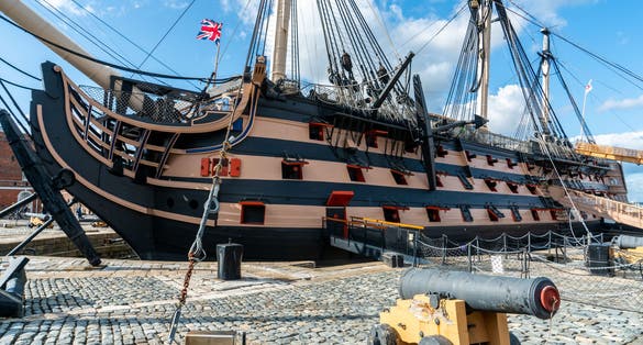 Photo of HMS Victory the Admiral Horatio Nelson's flagship at the Battle of Trafalgar in 1805 at Portsmouth Historic Dockyard, UK.