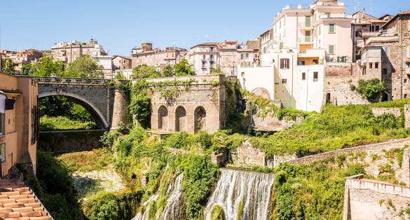 Beautiful park of Villa Gregoriana and charming buildings in Tivoli, Italy