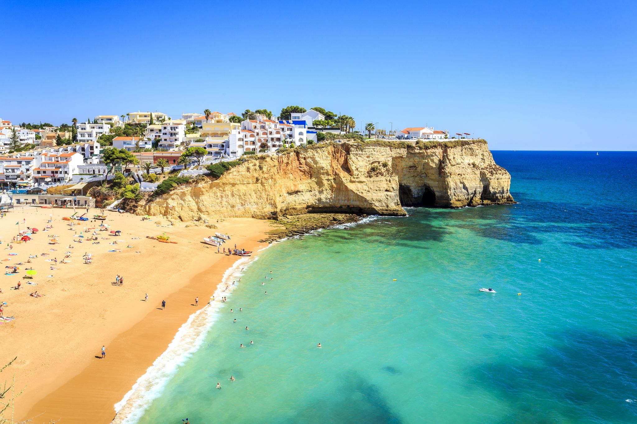 Photo of Carvoeiro fishing village with beautiful beach and colourful houses, Portugal.
