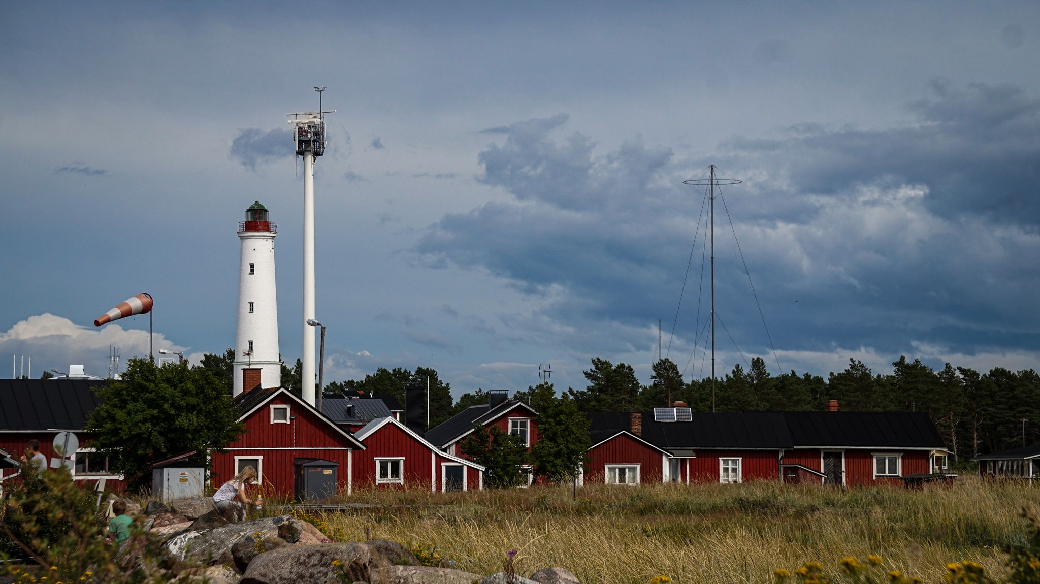 Photo of Marjaniemi lighthouse with red cabins, Denmark.