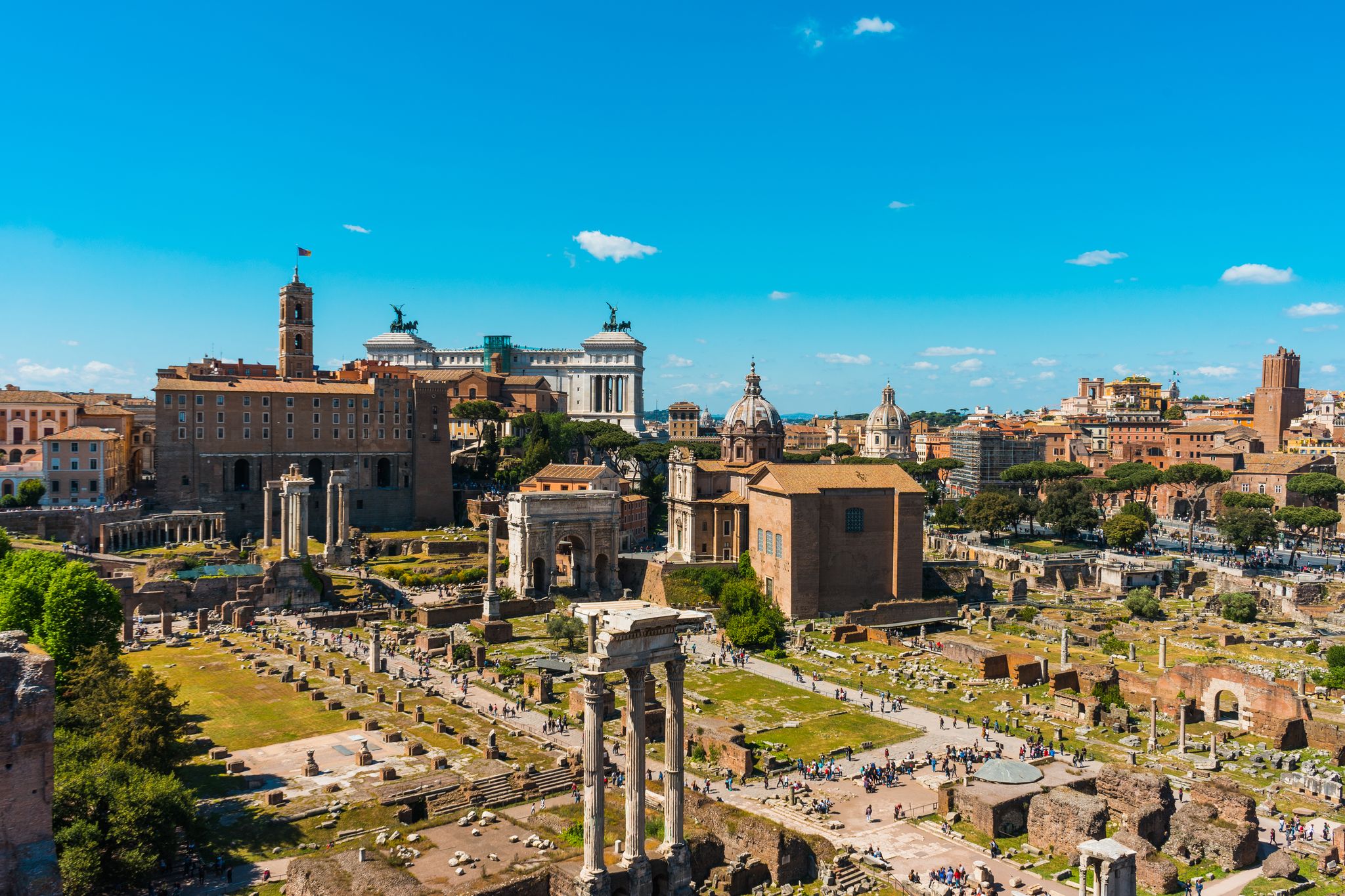photo of aerial view of the ancient roman forum, Rome, Italy, a popular tourist attraction, on a sunny blue sky day.