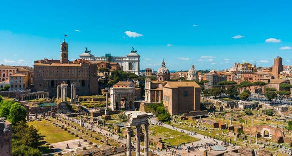photo of aerial view of the ancient roman forum, Rome, Italy, a popular tourist attraction, on a sunny blue sky day.