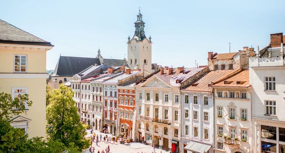 Photo of cityscape view on the old town with beautiful buildings and tower of Latin cathedral during the sunny weather in Lviv city in Ukraine.