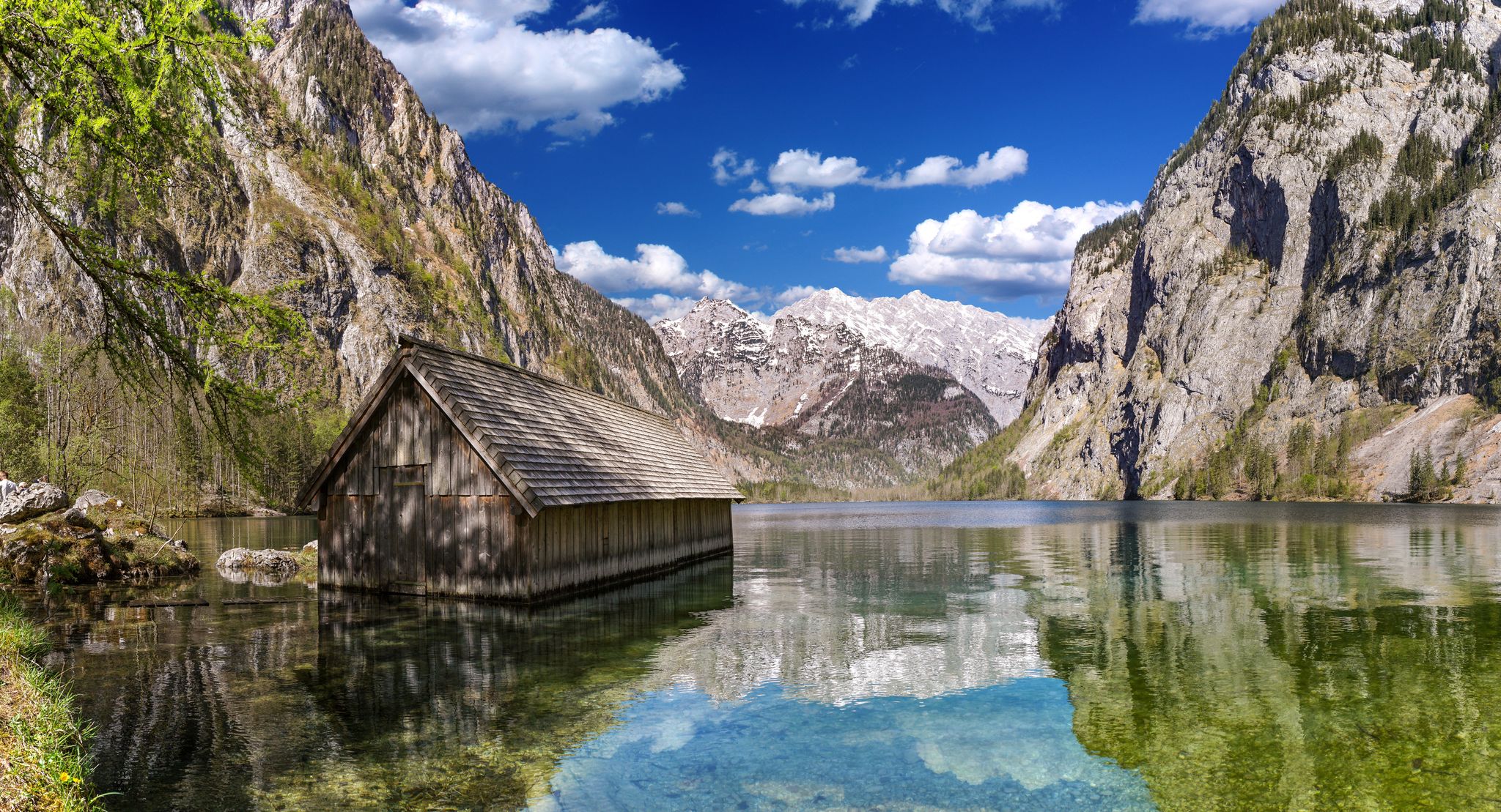 Photo of famous boat house hut with view on Obersee lake in front of Watzmann alpine mountain in the Berchtesgadener land bavaria national park ,German .
