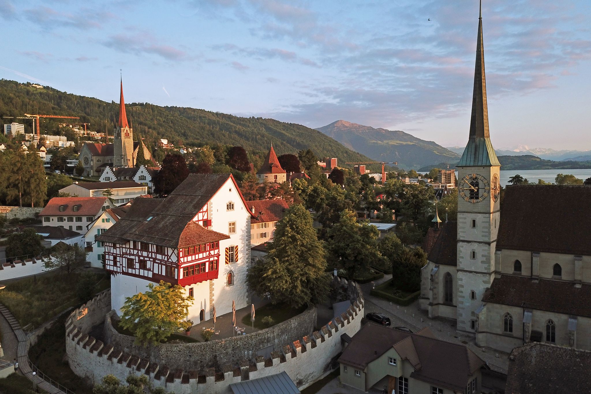 photo of aerial drone image of Zug, Switzerland with focus on the Zug Castle.