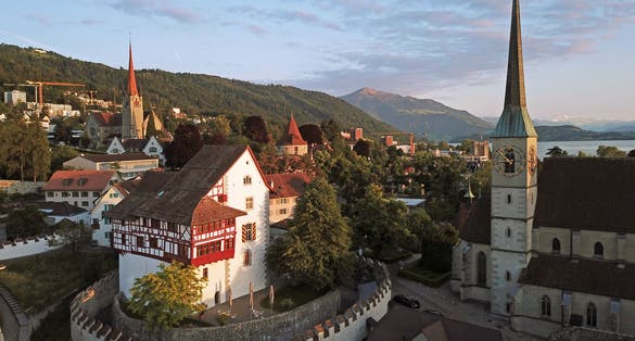 photo of aerial drone image of Zug, Switzerland with focus on the Zug Castle.