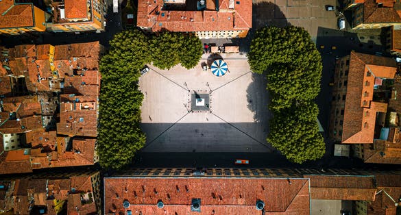 photo of view of Aerial photo of the square Piazza Del Napoleone in Lucca, Tuscany, Italy with a carrousel, Lucca, Italy.