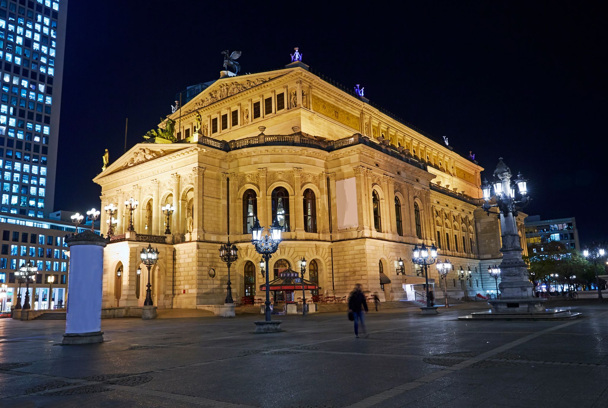 photo of view of Facade of 'Alte Oper' (Old Opera) opera house in Frankfurt illuminated at night, Frankfurt Oder, Germany.