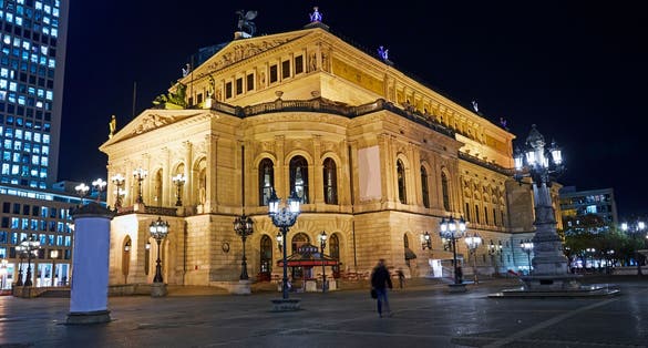 photo of view of Facade of 'Alte Oper' (Old Opera) opera house in Frankfurt illuminated at night, Frankfurt Oder, Germany.