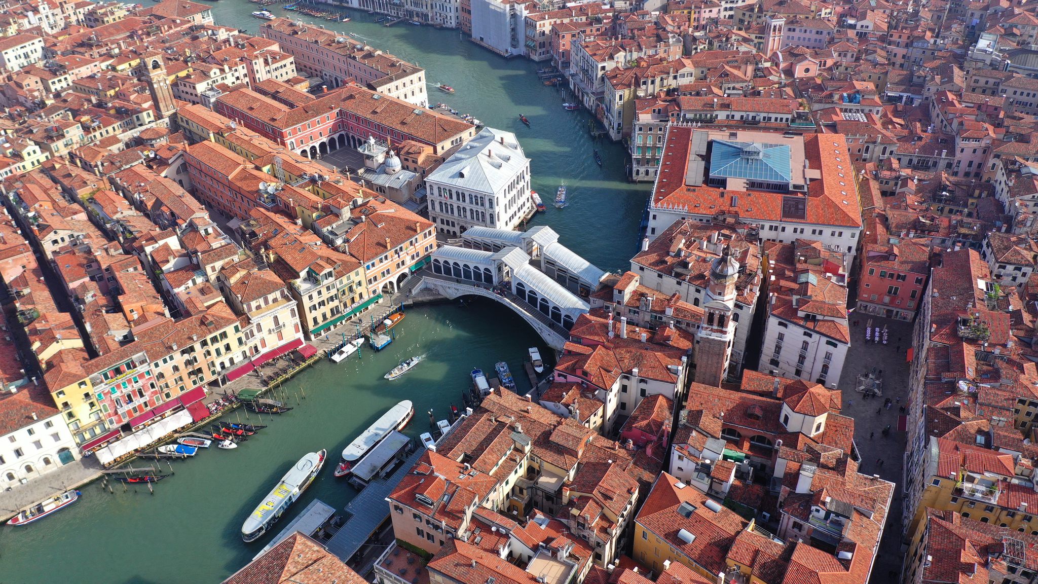 photo of Aerial drone photo of iconic and unique ponte rialto or rialto bridge crossing grand canal, Venice, Italy.