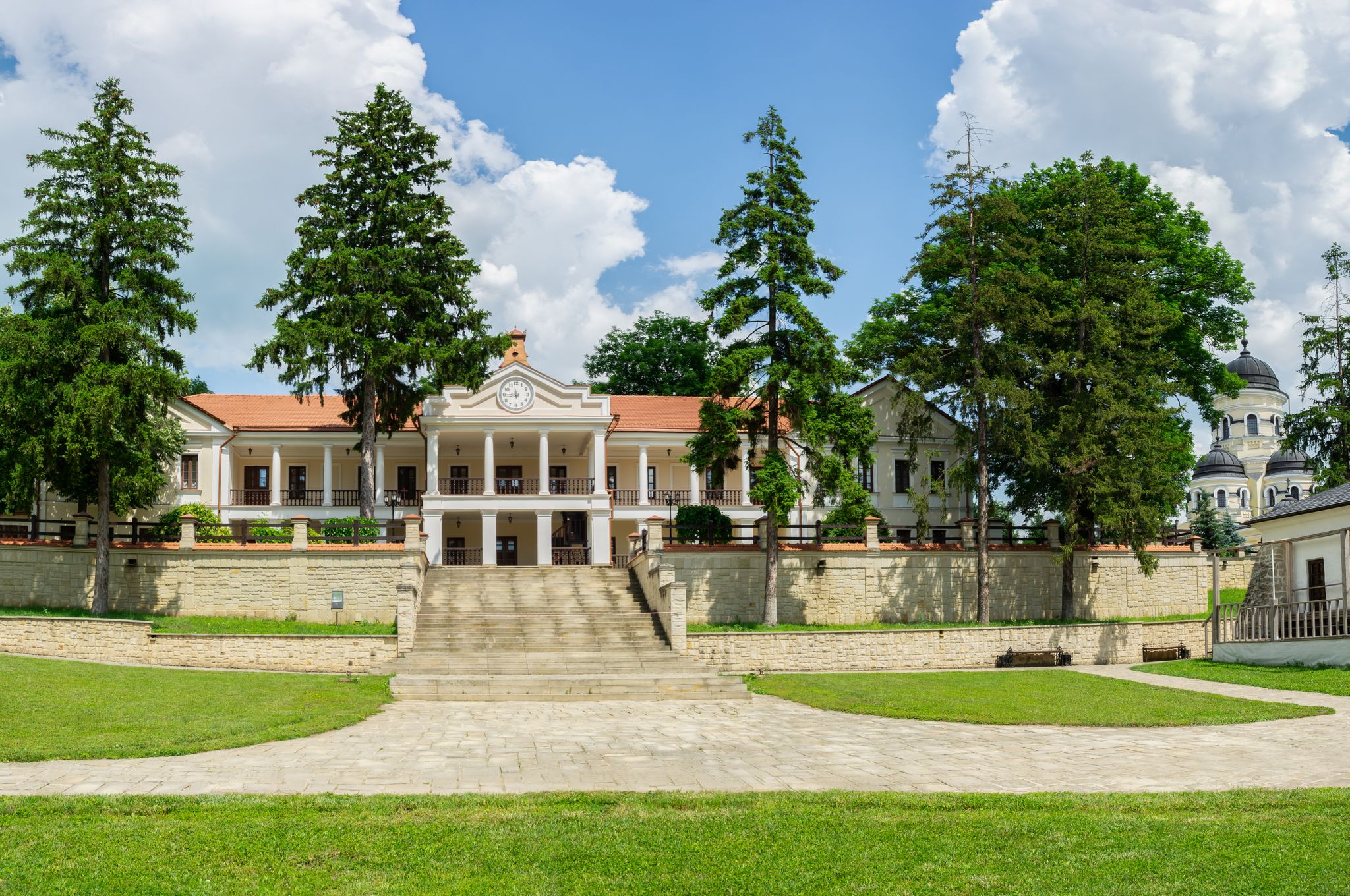 Photo of beautiful view of monastic building inside Capriana Monastery, Republic of Moldova.