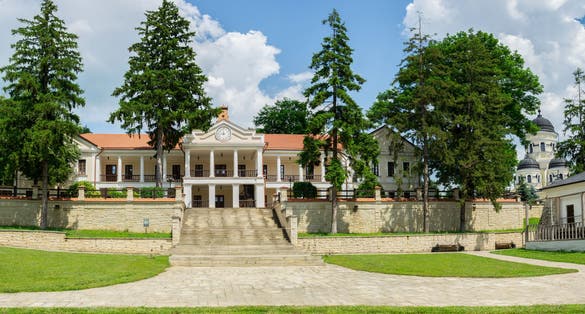 Photo of beautiful view of monastic building inside Capriana Monastery, Republic of Moldova.