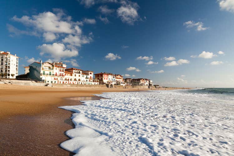 A large white water wave sliding on the Hossegor beach - France
