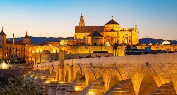 photo of view of Roman Bridge and Mosque Cathedral of Cordoba, Spain travel photo.