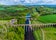 Photo of An aerial view of the Leaderfoot Viaduct, medieval bridge and modern road bridge in Scotland on a summers day .