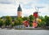 photo of panoramic cityscape from a sailing boat. Yacht marina, cathedral, traditional houses, windmill. Strängnäs, Mälaren lake, Sweden.