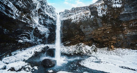 photo of Kvernufoss waterfall, Iceland. Icelandic winter landscape.