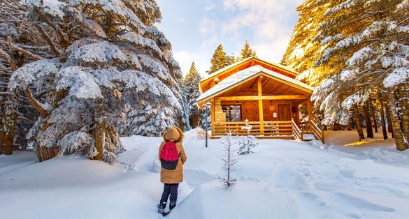 Beautiful winter landscape with snow covered trees. Forest with snow landscape and chalets. Uludag National Park, Bursa.