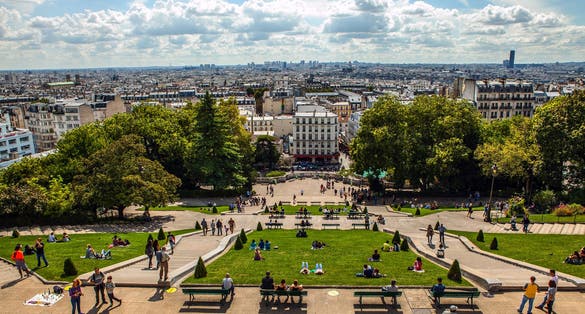 View from Montmartre to summer Paris and beautiful blue sky with soft clouds.