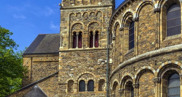 photo of exterior of the rear of the Romanesque Church Basilica of Our Lady Church in the historic center in Maastricht, the Netherlands.