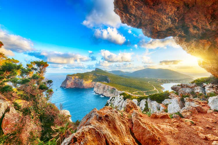 Fantastic morning view on Cacccia cape. View from the cave on the cliff, Alghero, Province of Sassari, Italy, Europe.