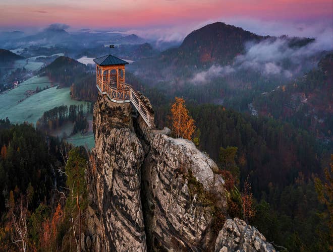 Viewing platform atop sandstone cliffs at Bohemian Switzerland National Park in Czechia in July..jpg