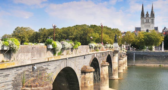 Photo of bridge and cathedral St Maurice Angers, France.