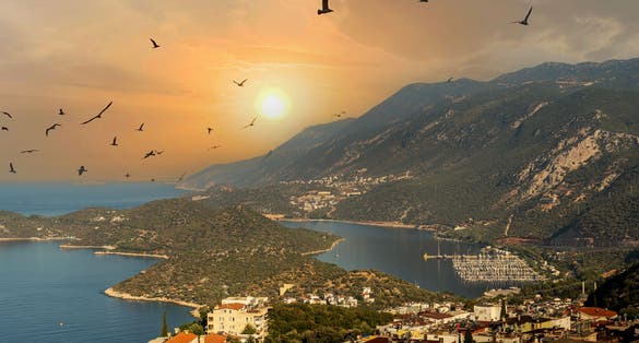 The view of the touristic town of Kaş on the Mediterranean coast with its green nature, mountains and deep blue sea. 