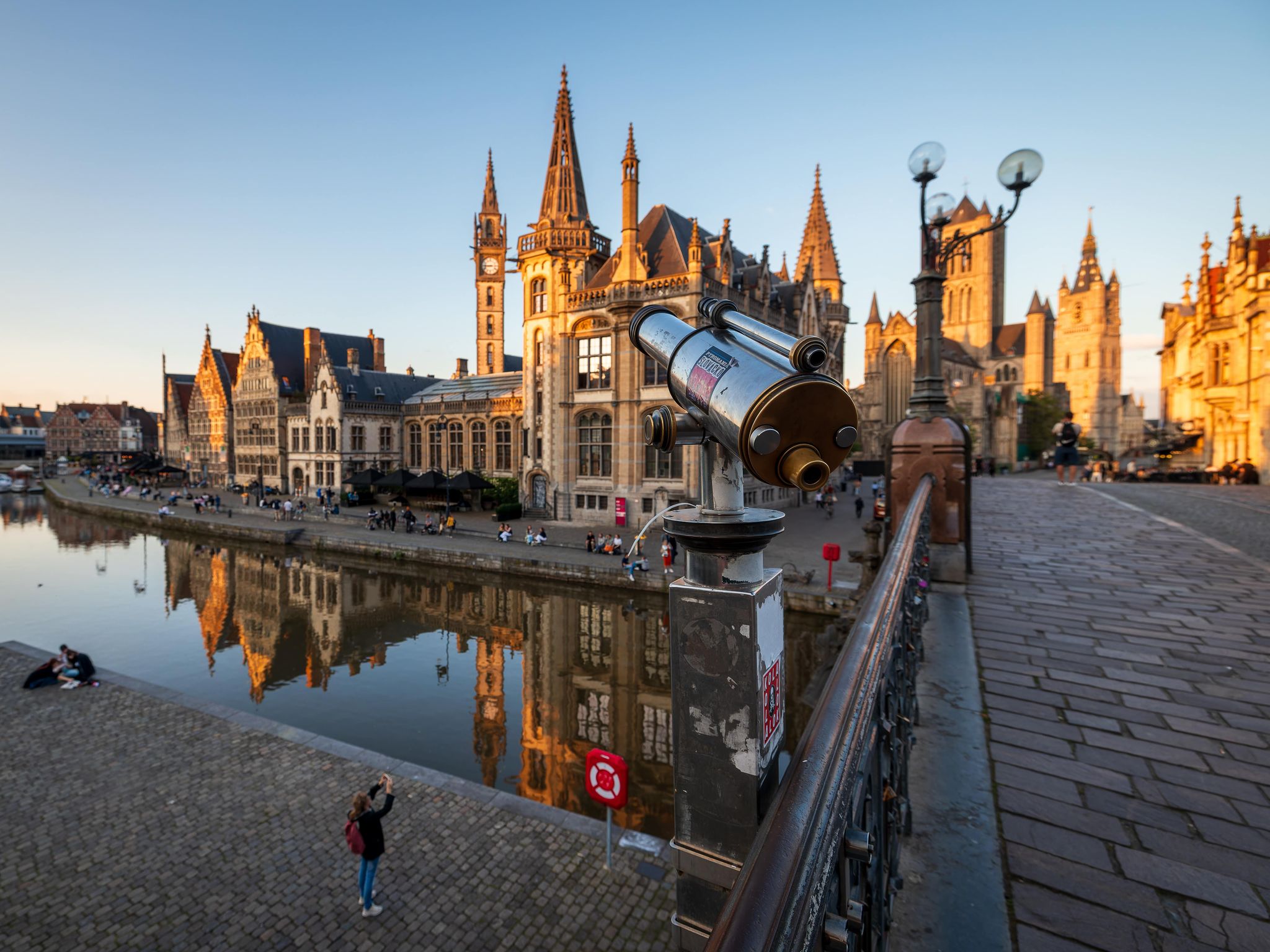 View of Graslei riverfront and medieval architecture in Ghent, Belgium, during a sunny spring afternoon.jpg