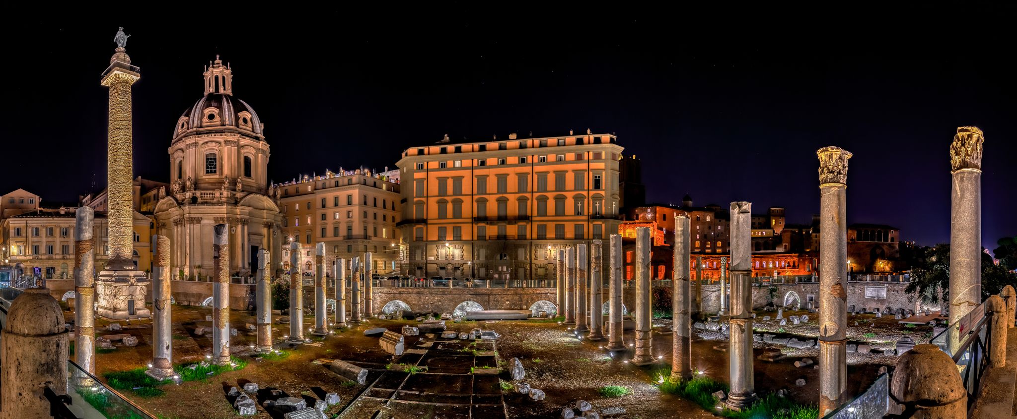 Trajan's Forum at Night in Piazza Venezia with Church of the Holy Name and Trajan Column in Rome, Italy